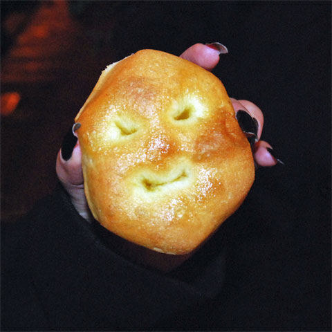 An Italian mini-pizza in which holes in the crust give it an appearance of a face.